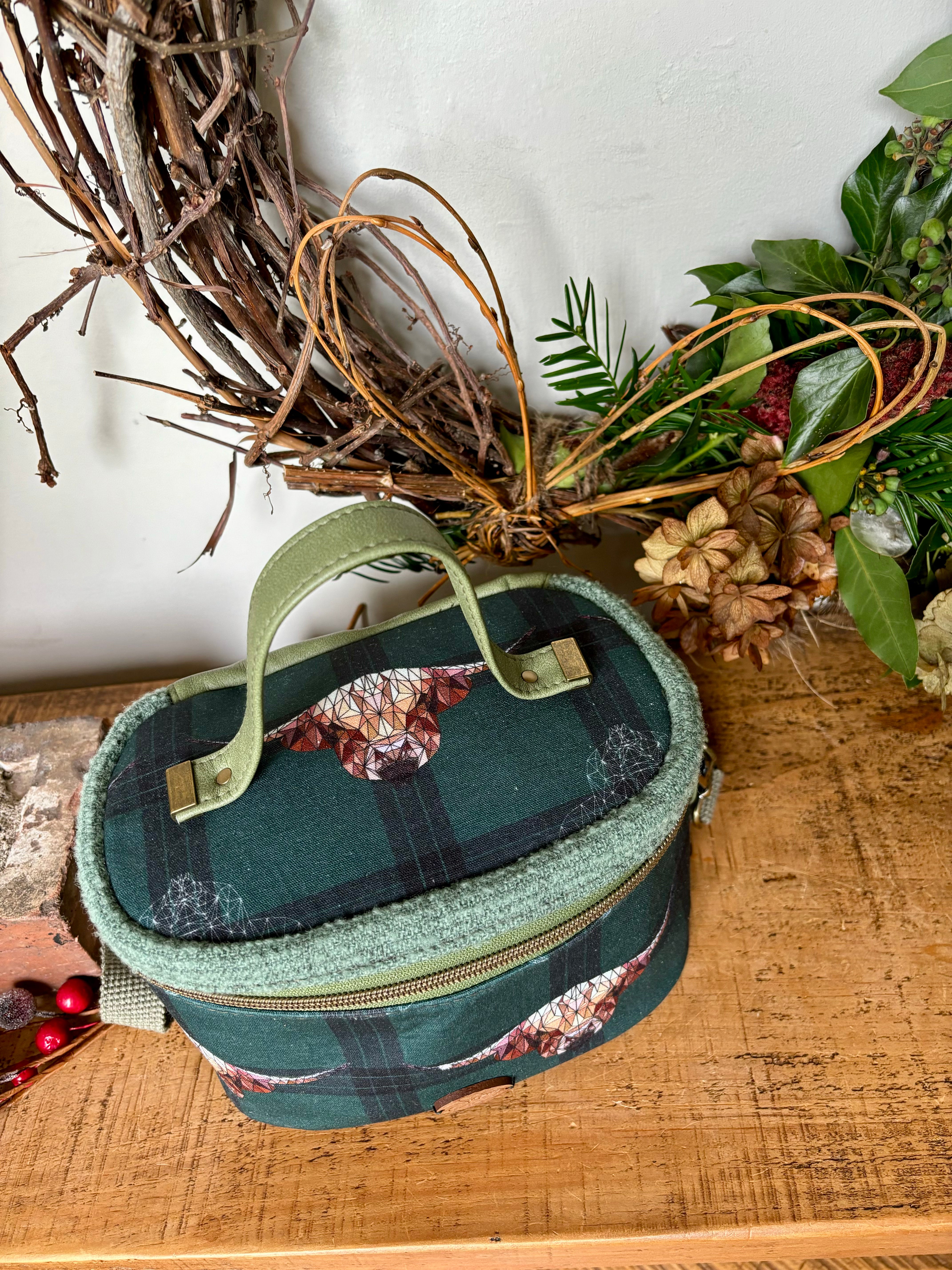 Charming Highland Cows Teresita Train Case, showcasing adorable Highland cattle in a picturesque design in green hues, providing both functionality and delightful aesthetics for your travel essentials.