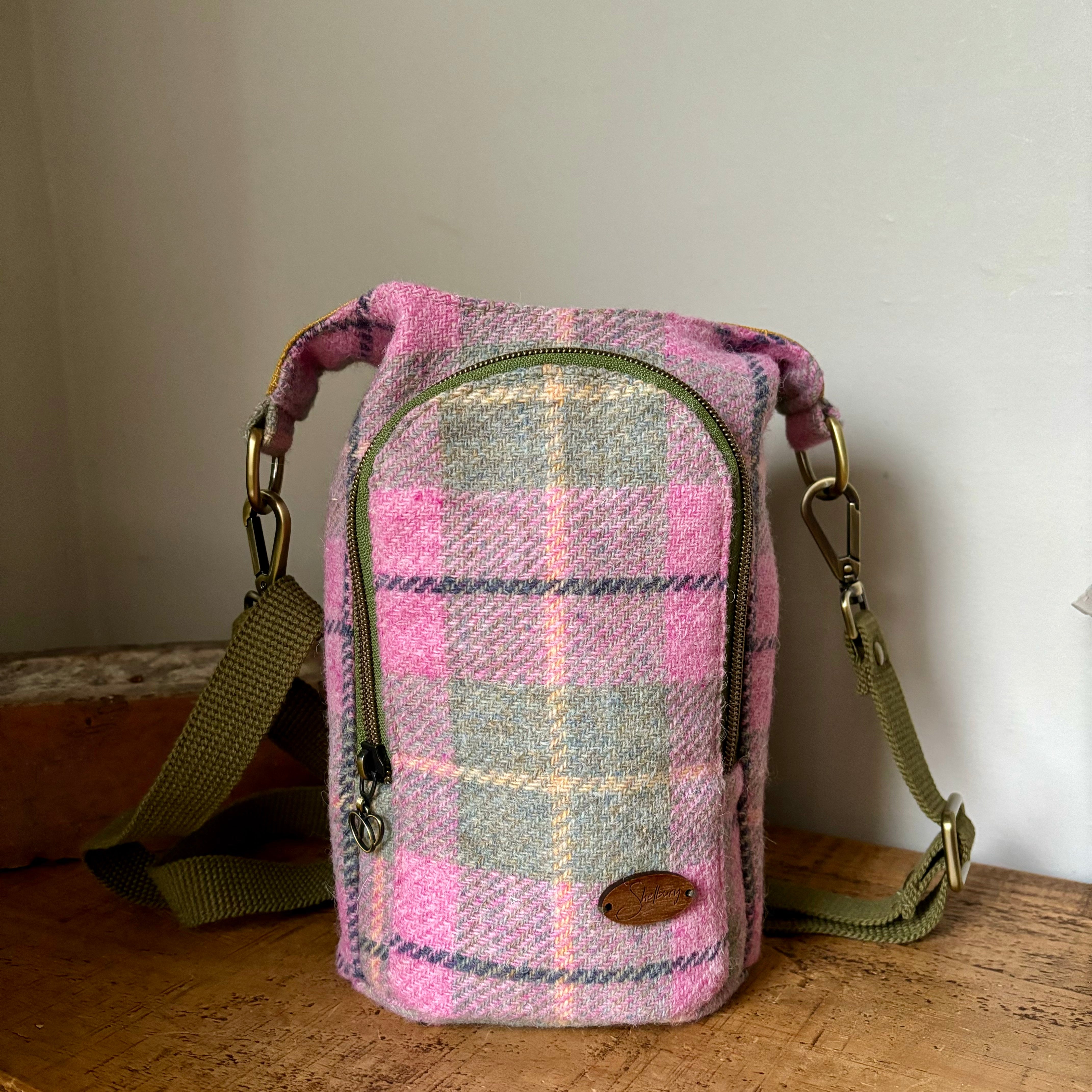 Limited Edition Sparkling Spirit Harris Tweed Bottle Bag in pastel pink, green, yellow with a stripe of blue.