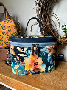 Exquisite Bellini Blossoms Teresita Train Case, a stylish and practical accessory for your beauty essentials, featuring a floral design in vibrant hues.