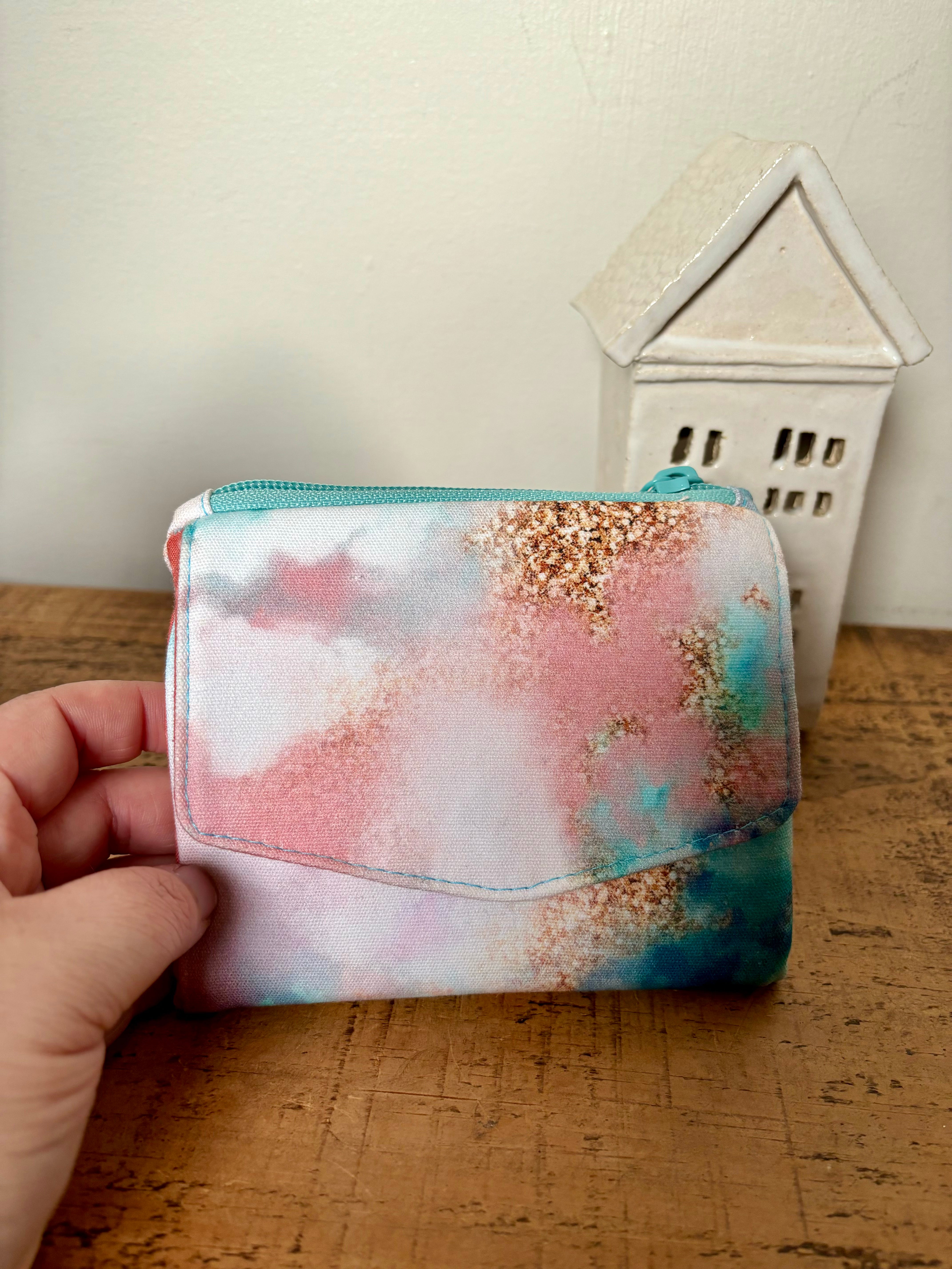 Limited Edition Prism Plum Compact Purse with Sugar Plum Sparkle, with icy turquoise blue, gold and pink hues.